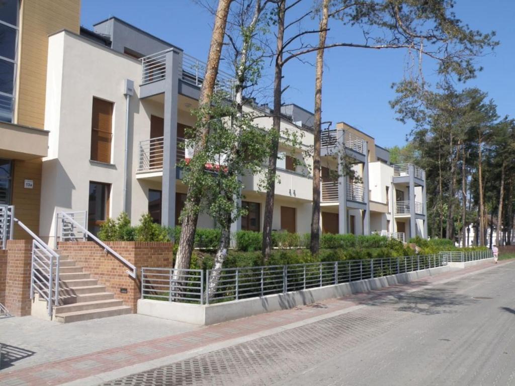 a row of apartment buildings on a street at Amber in Międzywodzie