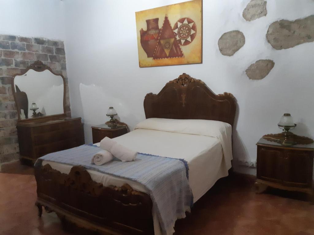 Postel nebo postele na pokoji v ubytování Casa rural el Burro