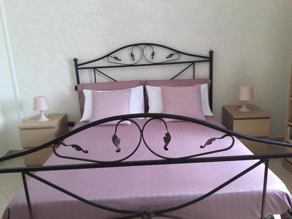 Postel nebo postele na pokoji v ubytování B&B LA PIETRA
