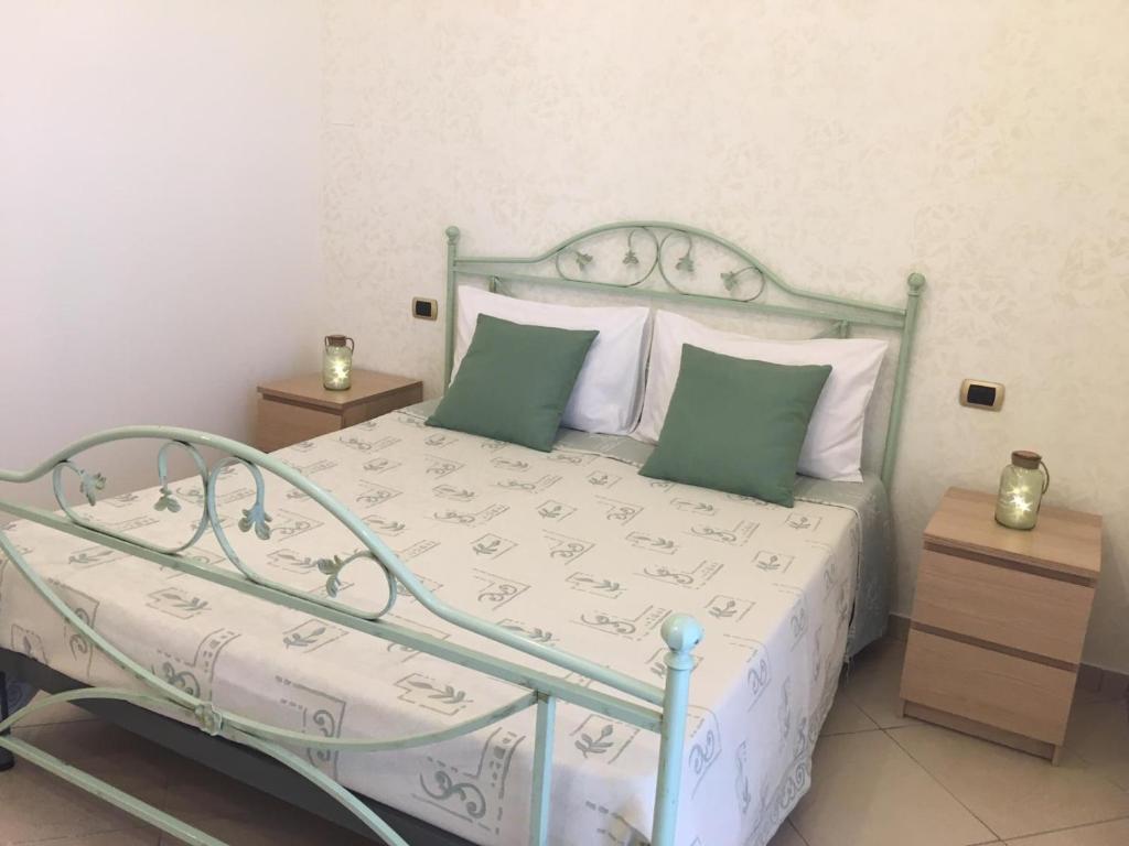 Postel nebo postele na pokoji v ubytování B&B LA PIETRA