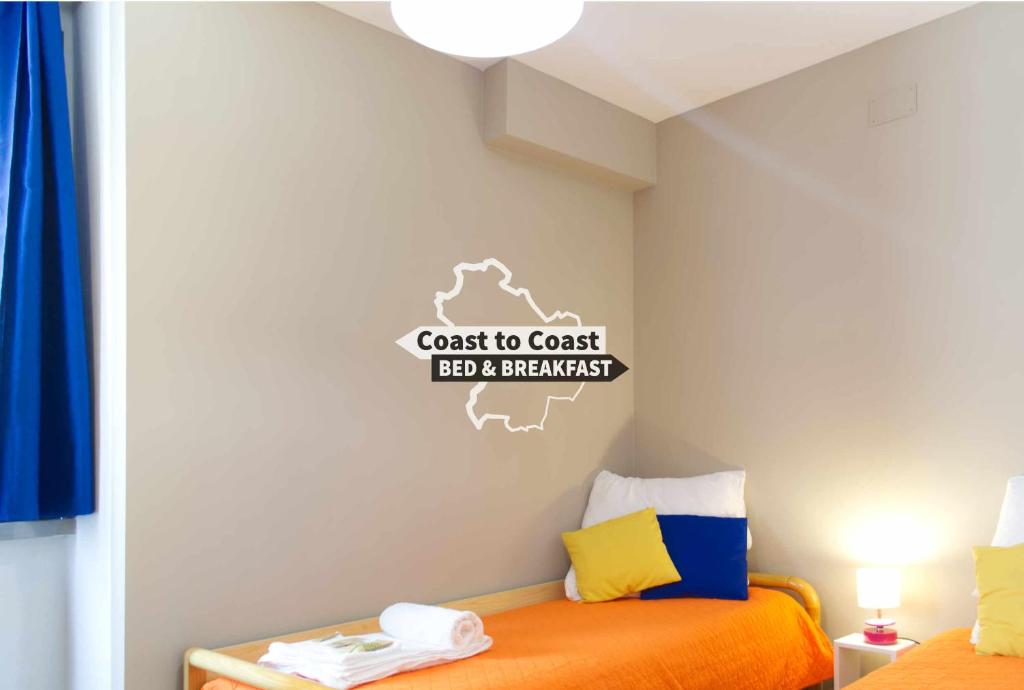 Postel nebo postele na pokoji v ubytování B&B Coast to Coast