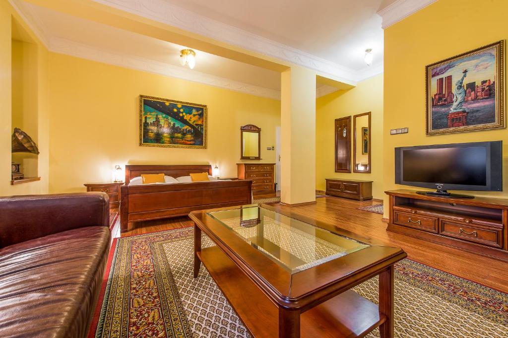Televízia a/alebo spoločenská miestnosť v ubytovaní Boutique Hotel Carpe Diem