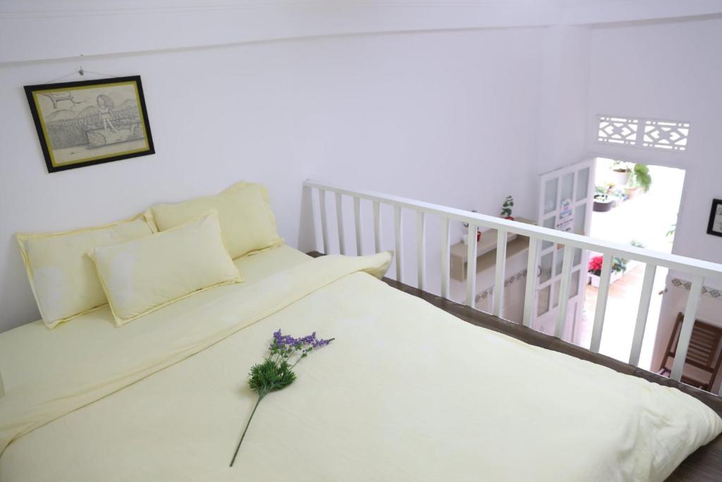 Postel nebo postele na pokoji v ubytování Strawberry Hotel Dalat