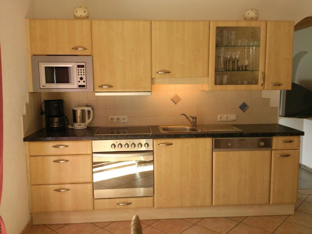 Kuchyň nebo kuchyňský kout v ubytování Appartement Claudia