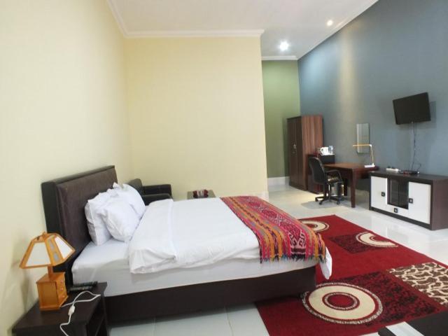 Postel nebo postele na pokoji v ubytování GLOBAL VIEW HOTEL