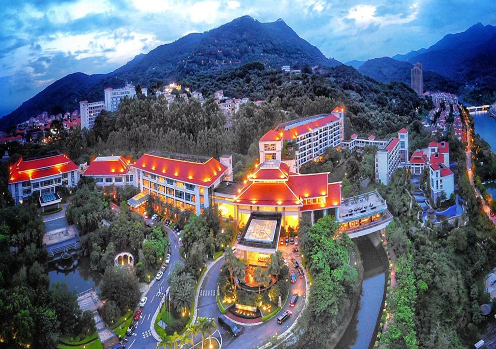 an overhead view of a city with a mountain at C&D Hotel,Putian in Putian