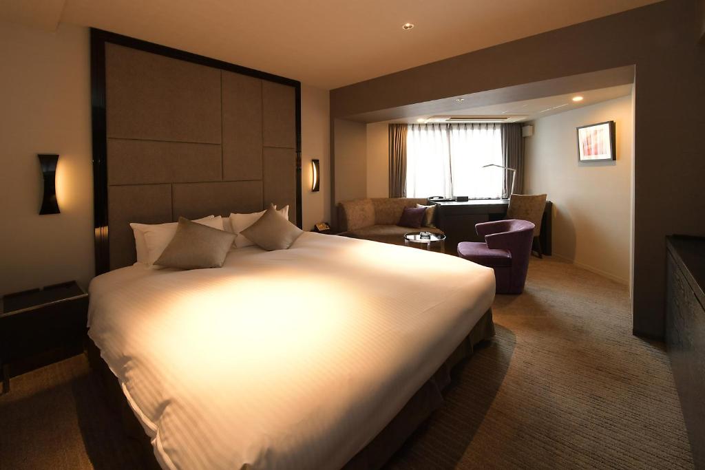 Lova arba lovos apgyvendinimo įstaigoje Hotel Trusty Nagoya Shirakawa