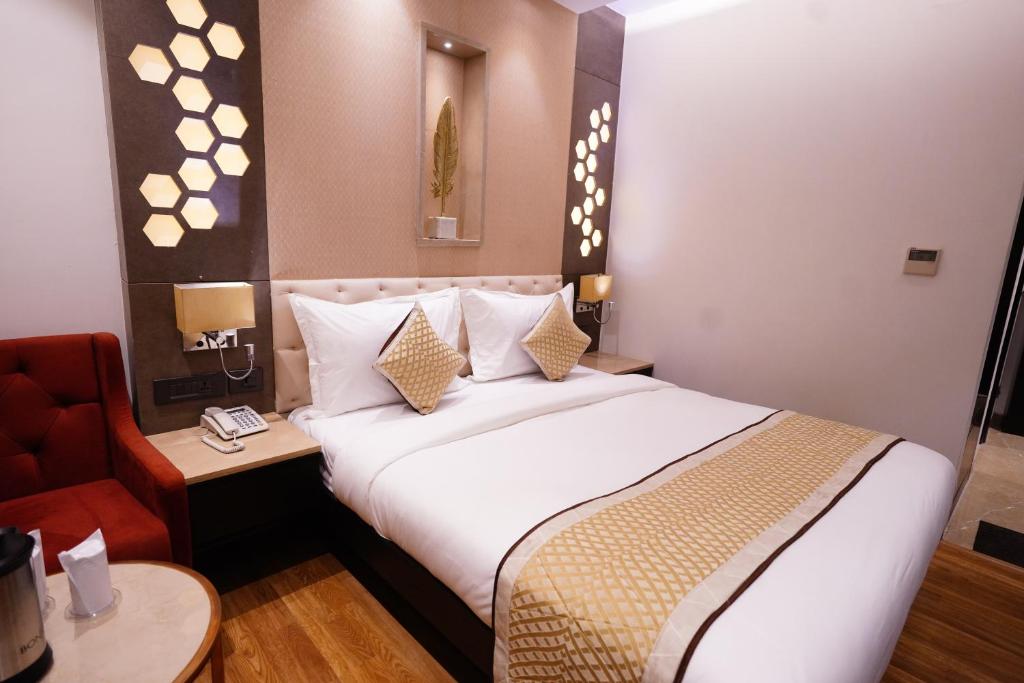 Postel nebo postele na pokoji v ubytování Hotel City Pride with Free Airport Pickup