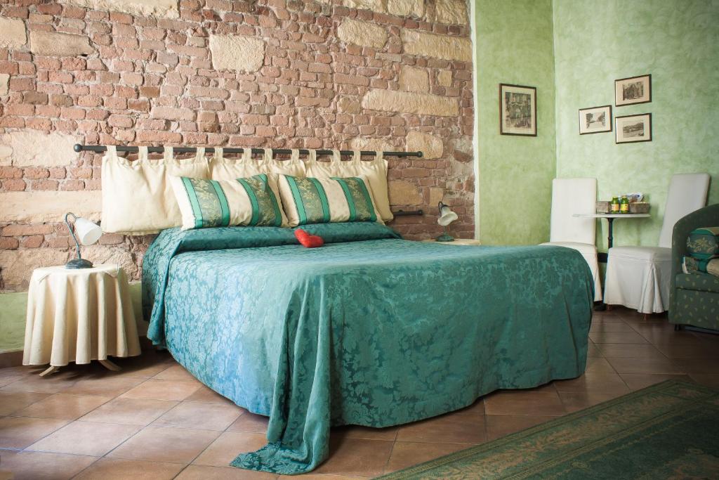 Postel nebo postele na pokoji v ubytování Anfiteatro B&B