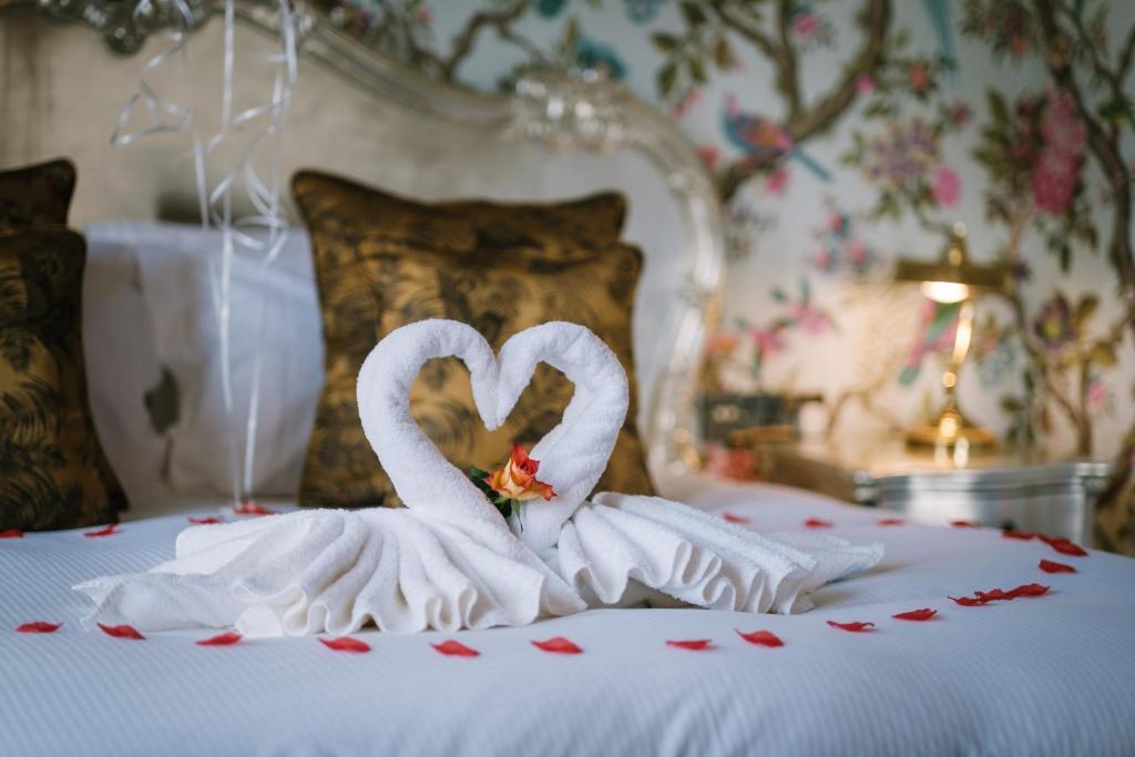 Postel nebo postele na pokoji v ubytování Grange Boutique Hotel