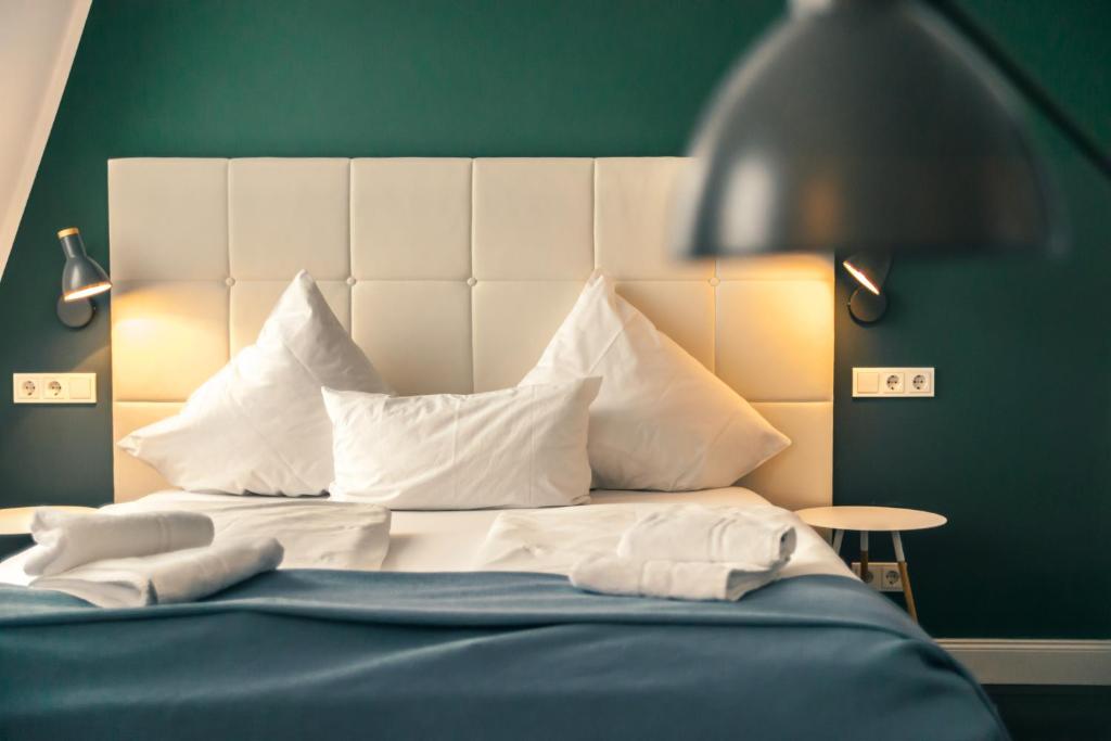 Postel nebo postele na pokoji v ubytování MAISON MARSIL - Boutique Hotel Köln