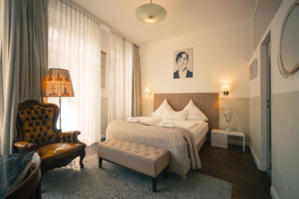 Postel nebo postele na pokoji v ubytování MAISON MARSIL - Boutique Hotel Köln