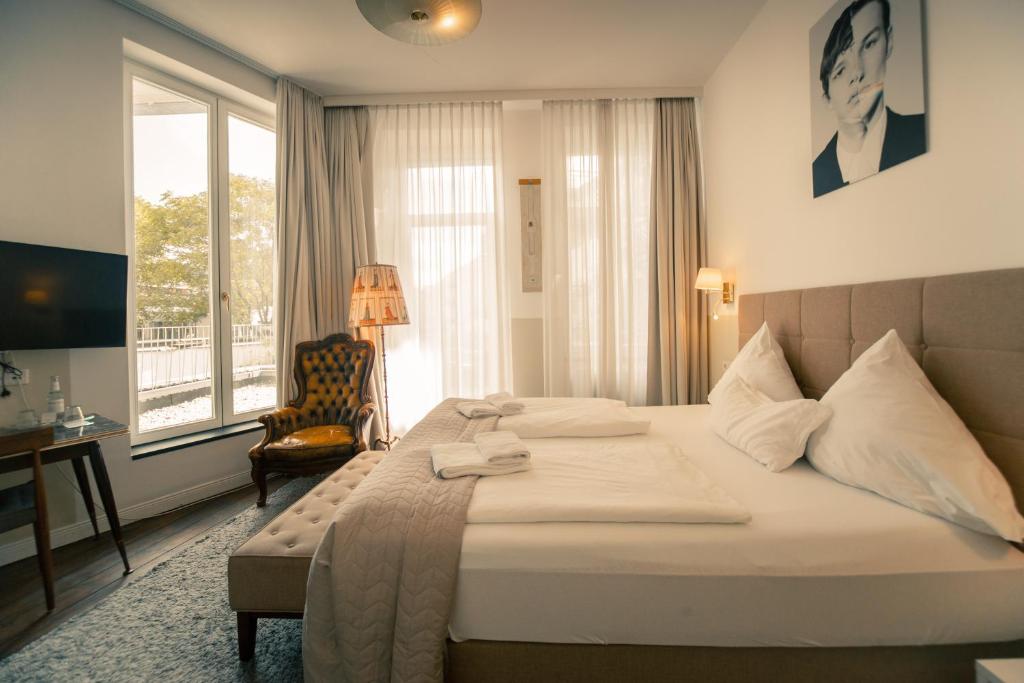Postel nebo postele na pokoji v ubytování MAISON MARSIL - Boutique Hotel Köln