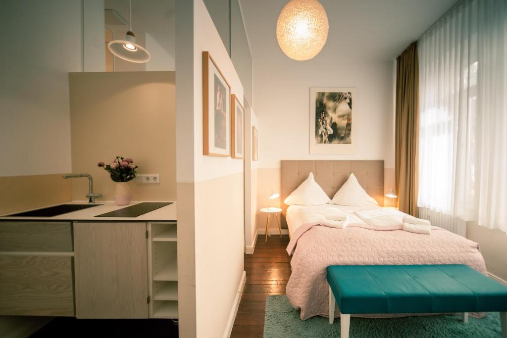 Postel nebo postele na pokoji v ubytování MAISON MARSIL - Boutique Hotel Köln