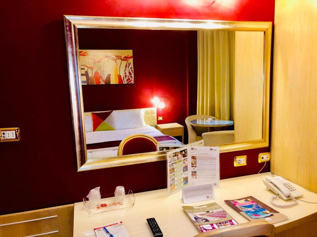 Postel nebo postele na pokoji v ubytování AS Hotel Sempione Fiera