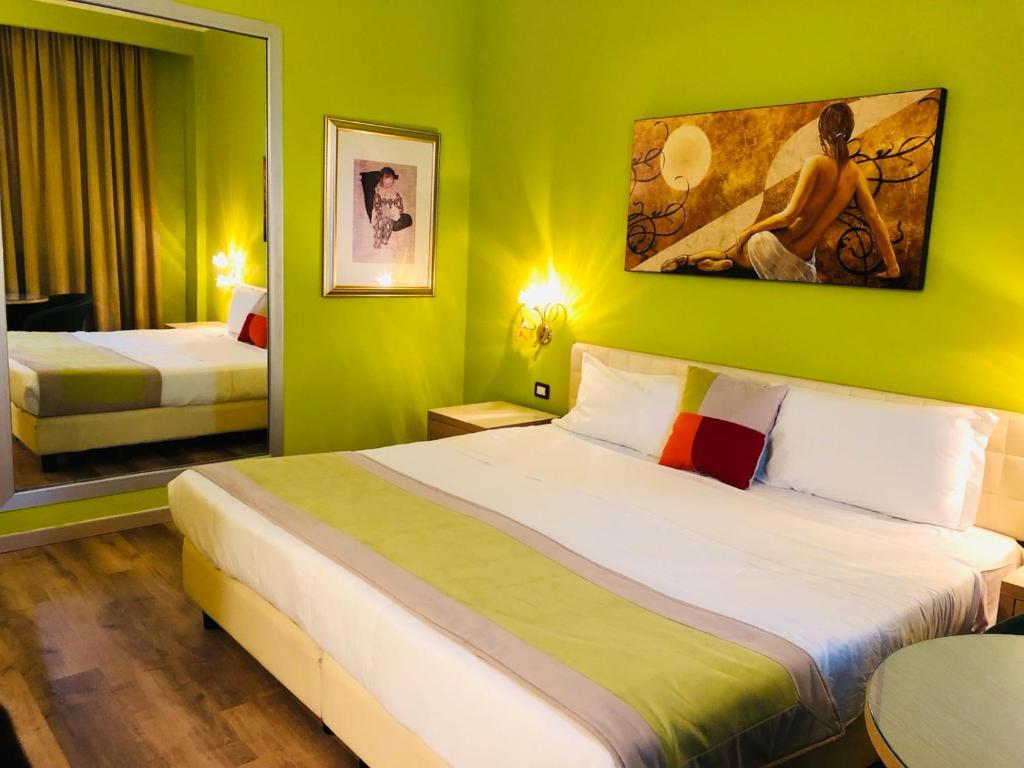 Postel nebo postele na pokoji v ubytování AS Hotel Sempione Fiera
