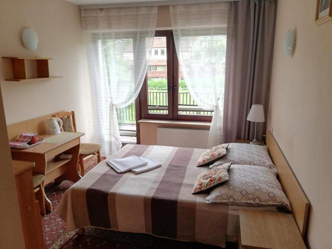 Posteľ alebo postele v izbe v ubytovaní Arnika Wynajem Pokoi