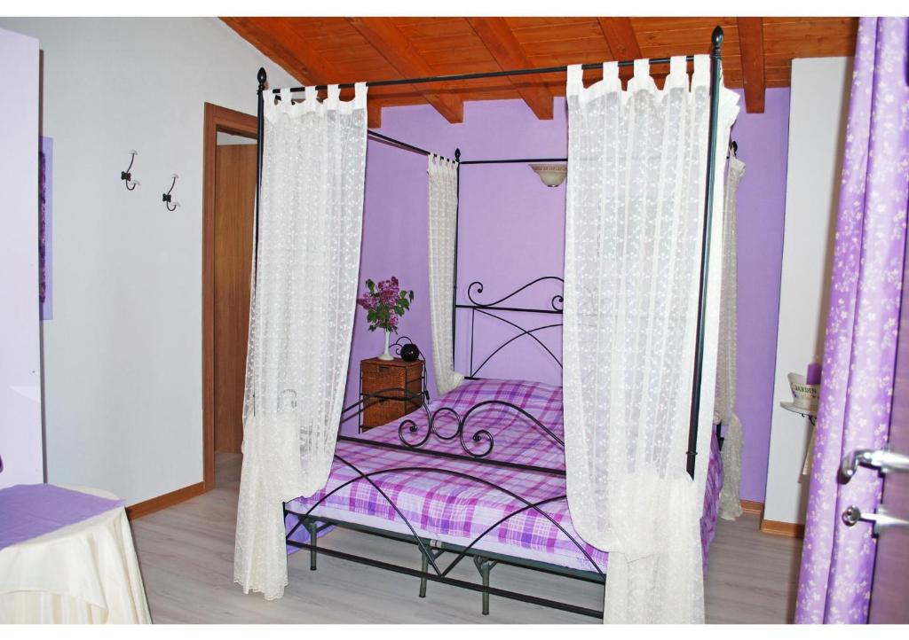 Postel nebo postele na pokoji v ubytování B&B I Viandanti