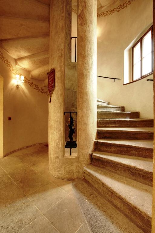 a staircase in a building with concrete columns at Alchymist Grand Hotel and Spa - Preferred Hotels & Resorts in Prague
