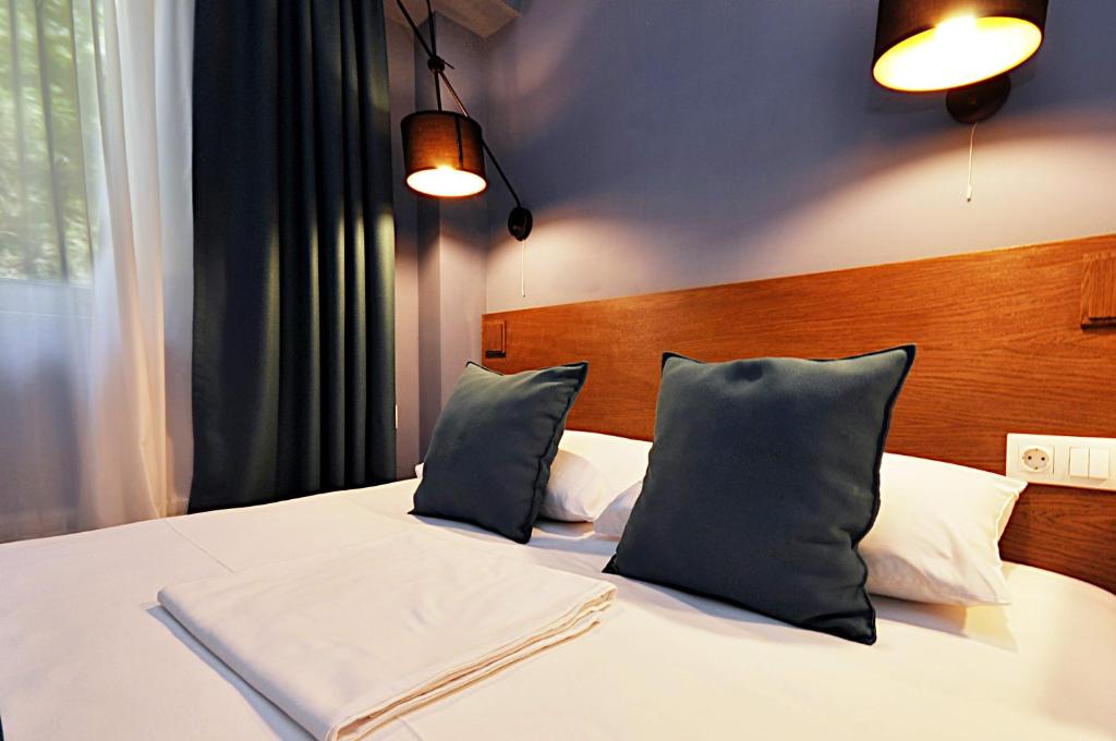 Postel nebo postele na pokoji v ubytování Elle Boutique Hotel