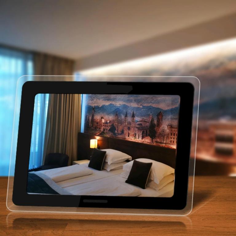 Postel nebo postele na pokoji v ubytování Hotel President Sarajevo