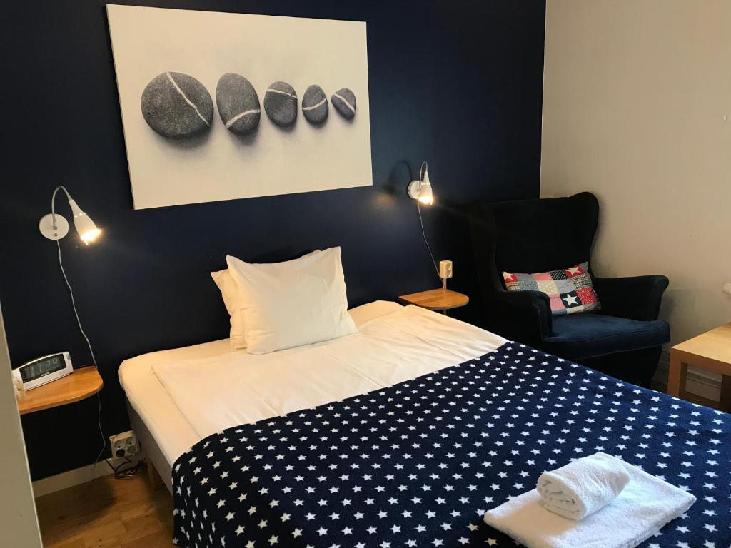 Postel nebo postele na pokoji v ubytování Port Hotel