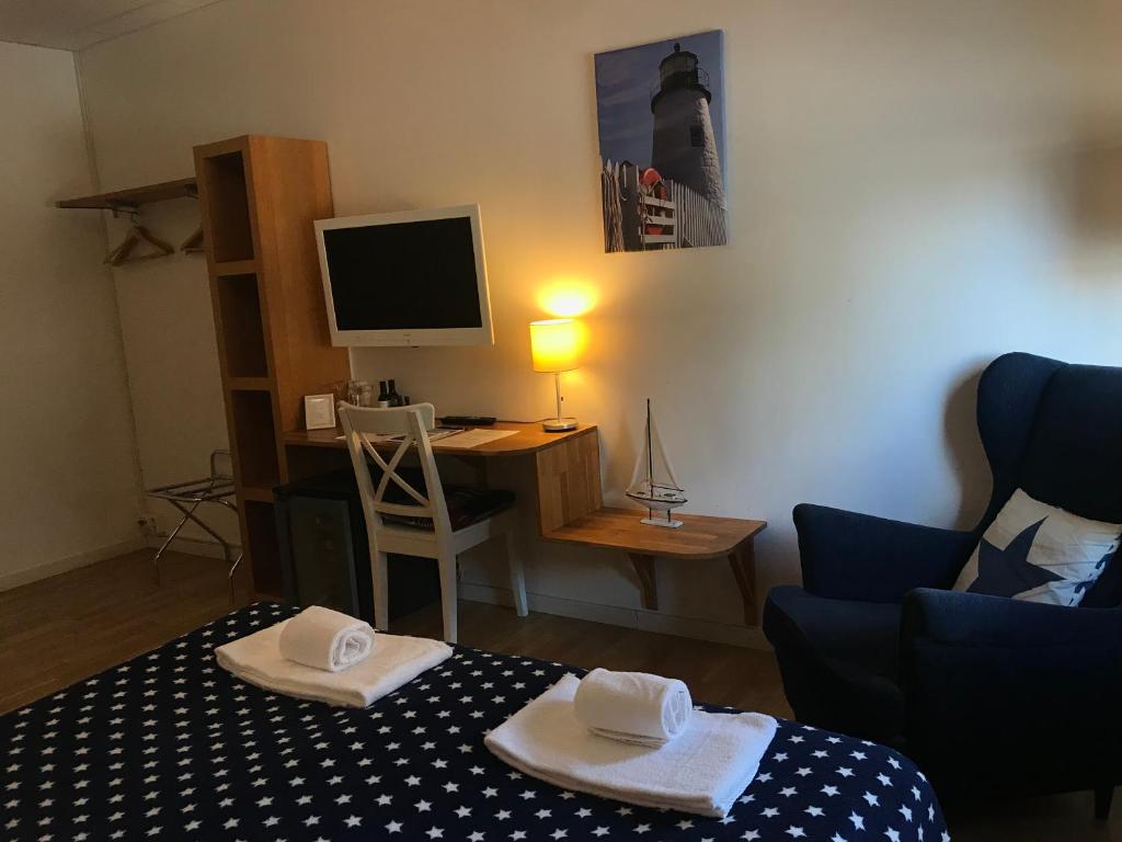 TV a/nebo společenská místnost v ubytování Port Hotel