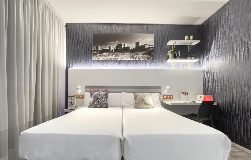 Postel nebo postele na pokoji v ubytování Hotel Luze El Villa