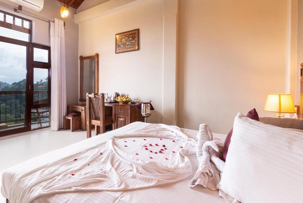 Postel nebo postele na pokoji v ubytování Piumara Residence