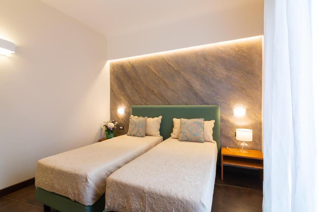 Postel nebo postele na pokoji v ubytování Il Melograno Relais