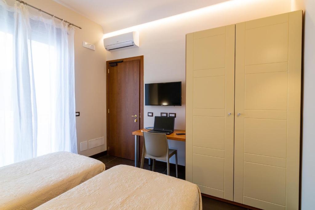Postel nebo postele na pokoji v ubytování Il Melograno Relais