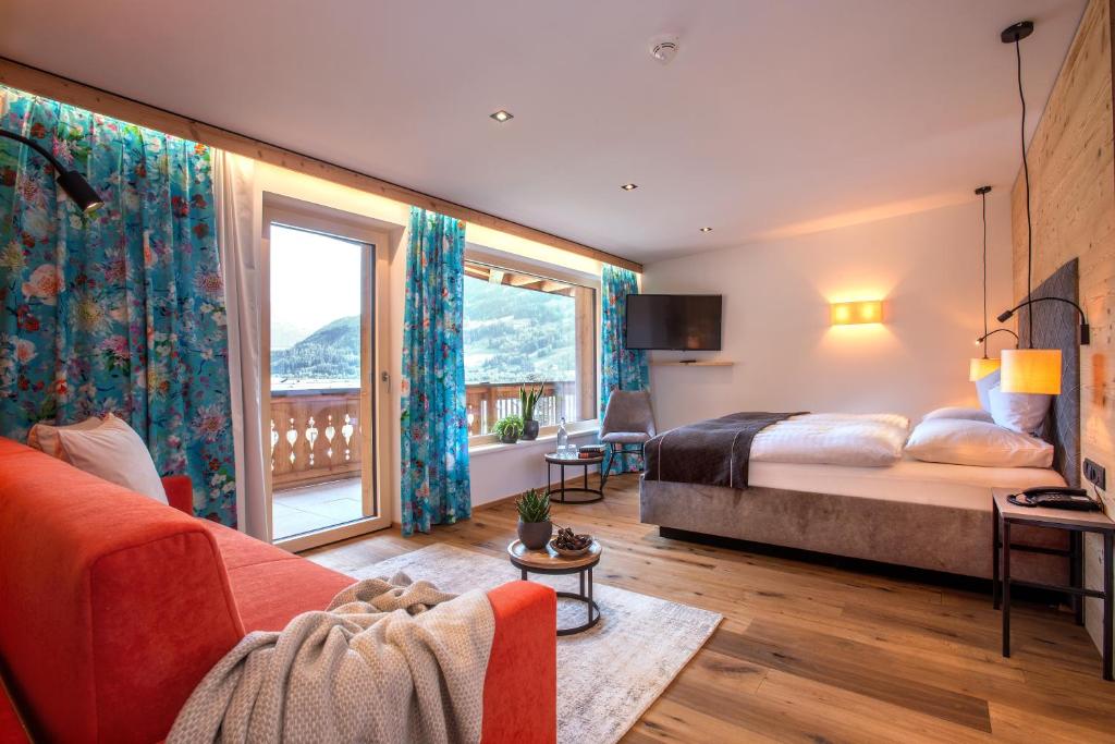 Postel nebo postele na pokoji v ubytování Hotel Tipotsch