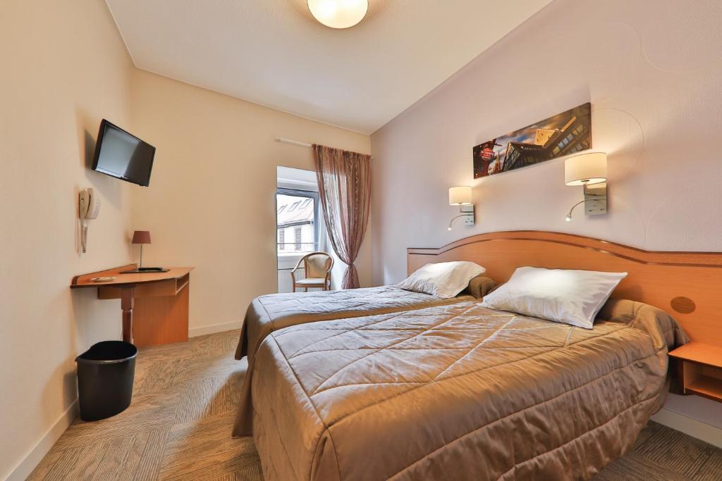 Postel nebo postele na pokoji v ubytování Hôtel Bar Des Vosges