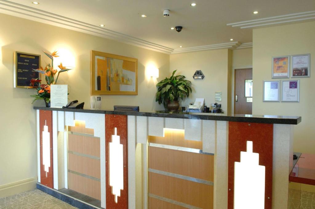 a lobby of a hospital with a reception counter at Carousel Hotel in Blackpool