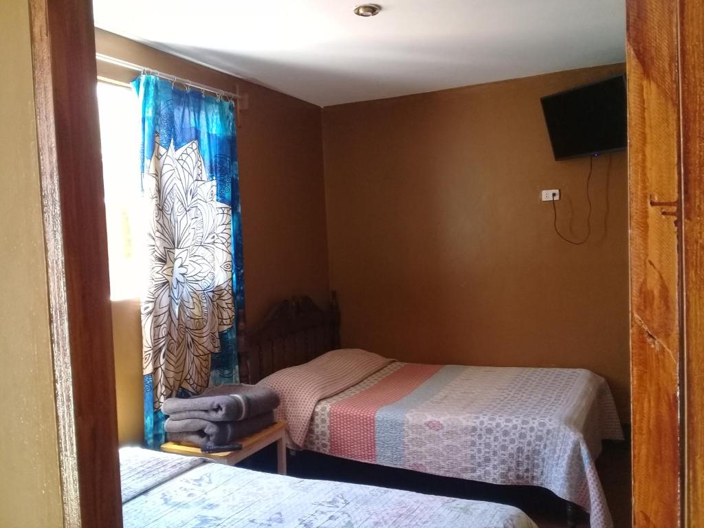 Postel nebo postele na pokoji v ubytování Hospedaje Rocha