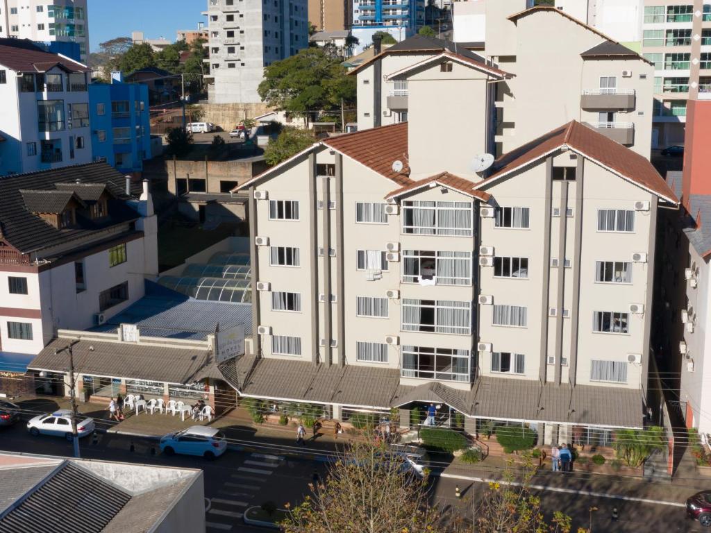 an aerial view of a building in a city at Villa das Termas Hotel in Piratuba