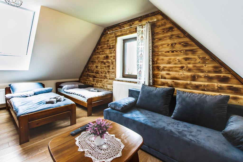 Postel nebo postele na pokoji v ubytování Apartamenty i Domki Orawskie