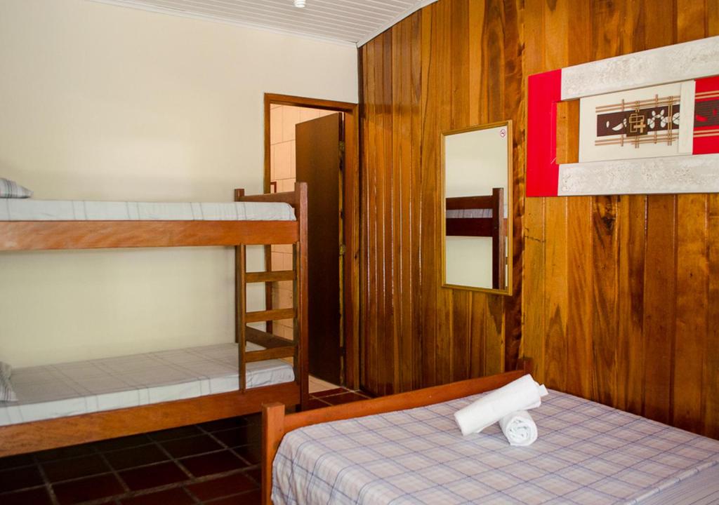 Cama ou camas em um quarto em Pousada Renascer