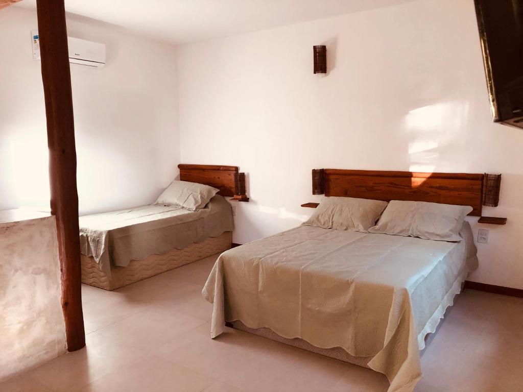 Postel nebo postele na pokoji v ubytování Sina Residencial