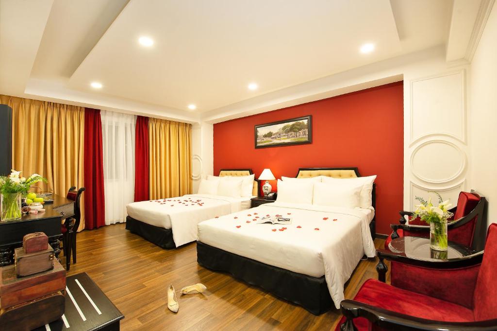 Postel nebo postele na pokoji v ubytování Adora Art Hotel
