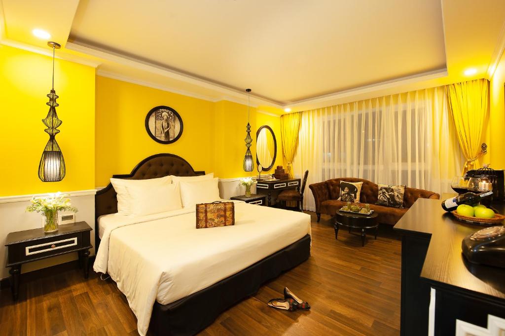 Postel nebo postele na pokoji v ubytování Adora Art Hotel