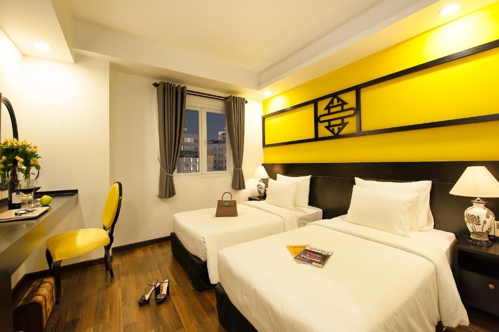 Postel nebo postele na pokoji v ubytování Adora Art Hotel