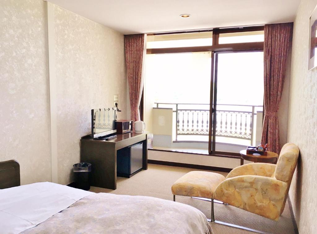Postel nebo postele na pokoji v ubytování Shoji Mount Hotel