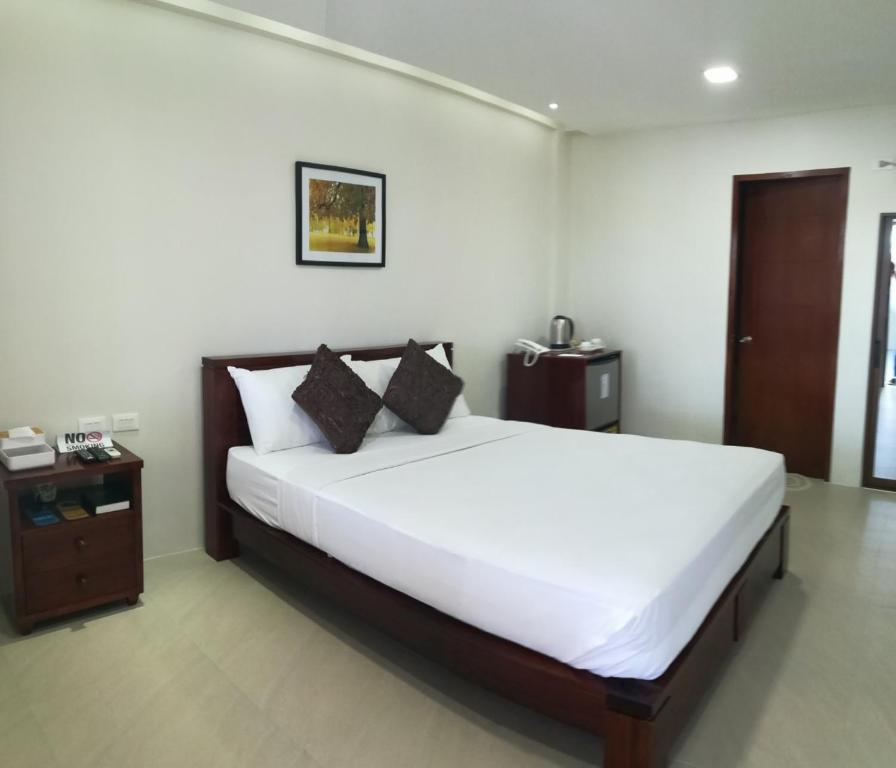 Postel nebo postele na pokoji v ubytování Nirvana Resort Puerto Galera