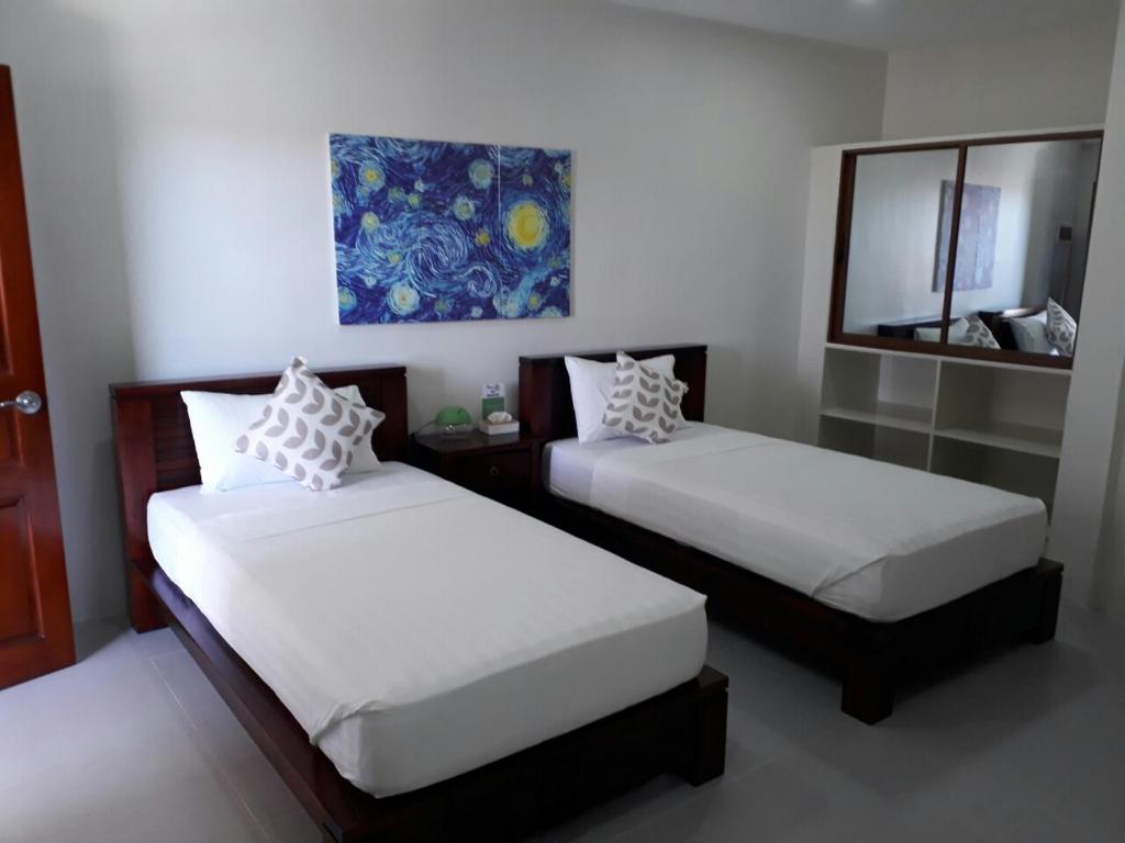 Postel nebo postele na pokoji v ubytování Nirvana Resort Puerto Galera