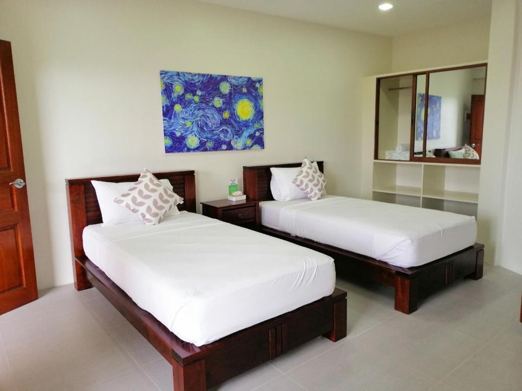 Postel nebo postele na pokoji v ubytování Nirvana Resort Puerto Galera
