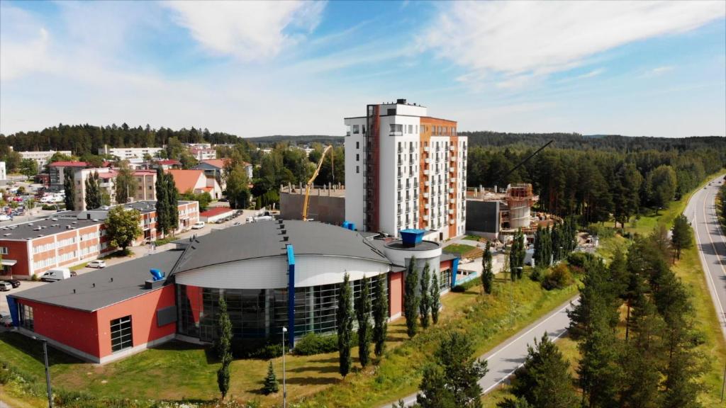 an aerial view of a city with a building at Hotelli Kuohu Kangasala in Kangasala