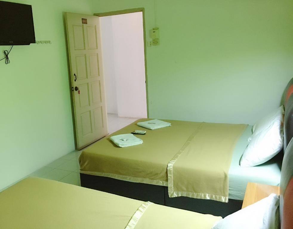 Postel nebo postele na pokoji v ubytování Dindings Pantai Desair Apartment By DPD