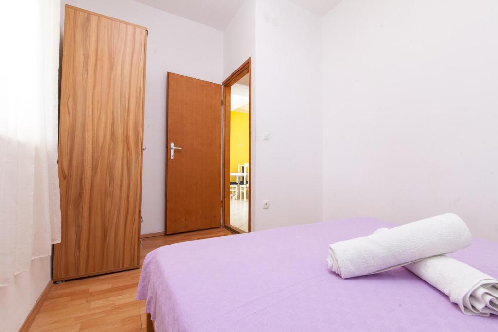 Posteľ alebo postele v izbe v ubytovaní Kuća Ella