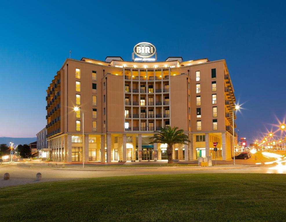 a building with a clock on top of it at night at Best Western Hotel Biri in Padova